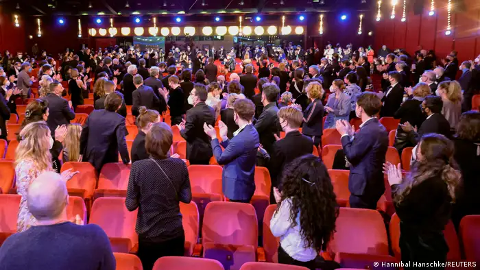Healthcare workers receive a standing ovation during the opening ceremony of the 72nd Berlinale International Film Festival in Berlin