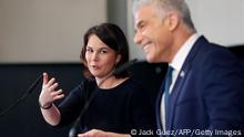 German Foreign Minister Annalena Baerbock and her Israeli counterpart Yair Lapid give a joint press conference in Tel Aviv on February 10, 2022 during her official visit to Israel. (Photo by JACK GUEZ / AFP) (Photo by JACK GUEZ/AFP via Getty Images)