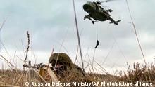 In this photo taken from video provided by the Russian Defense Ministry Press Service on Friday, Feb. 10, 2022, soldiers train at the training ground in the Brest region during the Union Courage-2022 Russia-Belarus military drills in Belarus. (Russian Defense Ministry Press Service via AP)