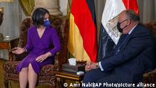 Egyptian Foreign Minister Sameh Shoukry, right, meets with his German counterpart Annalena Baerbock in Cairo, Egypt, Saturday, Feb. 12, 2022. (AP Photo/Amr Nabil)
