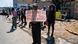 A disgruntled South African job seeker belonging to “Alexandra Dudula Movement” holds a banner reading “Foreigners Must Go Home” A disgruntled South African job seeker belonging to “Alexandra Dudula Movement” holds a banner reading “Foreigners Must Go Home”