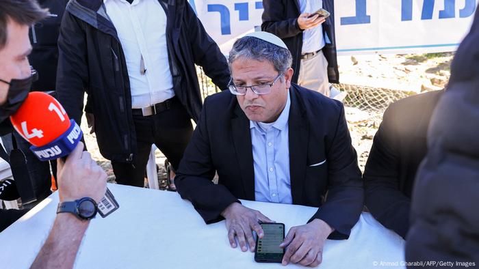 Itamar Ben-Gvir, an Israeli lawmaker, sits at a table in a makeshift office in the east Jerusalem neighborhood of Sheikh Jarrah
