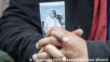 epaselect epa05451817 A man holds picture of the priest Jacques Hamel during his funeral mass at the Cathedral of Rouen in Rouen, on 02 July 2016. Hamel was killed on 26 July in a terror related attack, in Saint-Etienne-du-Rouvray, near Rouen, 28 July 2016. The two hostage takers were killed by police after they took five hostages and killed Priest Jacques Hamel. EPA/CHRISTOPHE PETIT TESSON ++