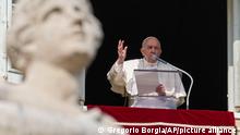 Pope Francis speaks to pilgrims and faithful gathered in St. Peter's Square at The Vatican, Sunday, Feb. 13, 2022, for the traditional Sunday's Angelus prayer. Pope Francis prayed for a peaceful political solution to tensions in Ukraine during the traditional Sunday blessing. (AP Photo/Gregorio Borgia)