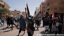 People protesting in the streets of Khartoum
