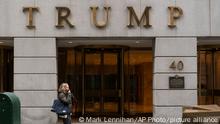 FILE - A woman walks past the Trump Building in New York's financial district, Wednesday, Jan. 13, 2021. Mazars USA LLP, the accounting firm that prepared former President Donald Trump’s annual financial statements, says the documents “should no longer be relied upon” after investigators said they found evidence he and his company regularly misstated the value of assets. (AP Photo/Mark Lennihan, File)