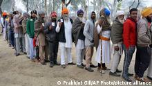 04.02.2017
Indians display their election identity cards as they stand in a queue to cast their votes outside a polling station at Kamaseke village, about 40 kilometers from Amritsar, in the northern Indian state of Punjab, Saturday, Feb. 4, 2017. Hundreds of paramilitary troops and police were posted near voting stations across Punjab to ensure security as voters stood in long lines to cast their vote. (AP Photo/Prabhjot Gill)