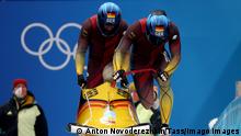 BEIJING, CHINA - FEBRUARY 15, 2022: Athletes Francesco Friedrich and Thorsten Margis of Germany compete in the two-man bobsleigh event at the Yanqing National Sliding Centre as part of the 2022 Winter Olympic Games, Olympische Spiele, Olympia, OS Anton Novoderezhkin/TASS PUBLICATIONxINxGERxAUTxONLY TS1234B9
