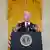Joe Biden speaks at a podium