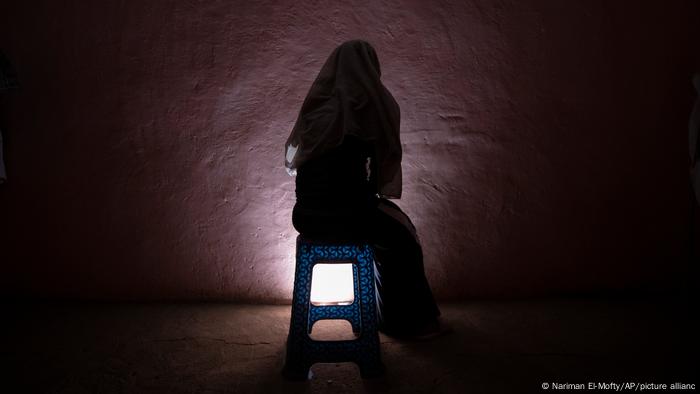 woman sitting on a stool 