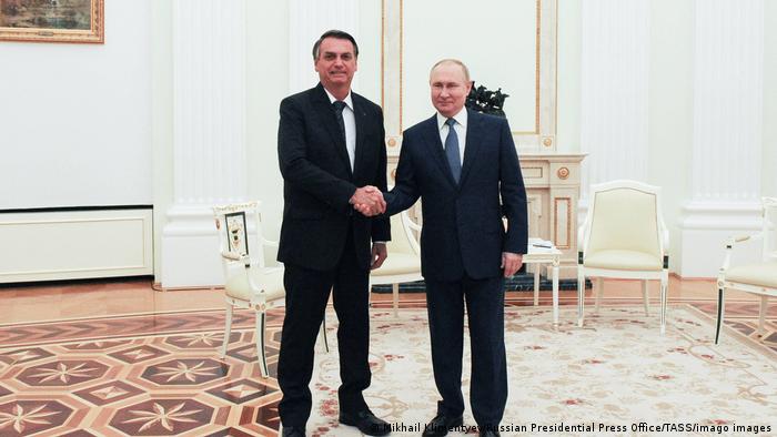 Bolsonaro and Putin shaking hands at the Kremlin