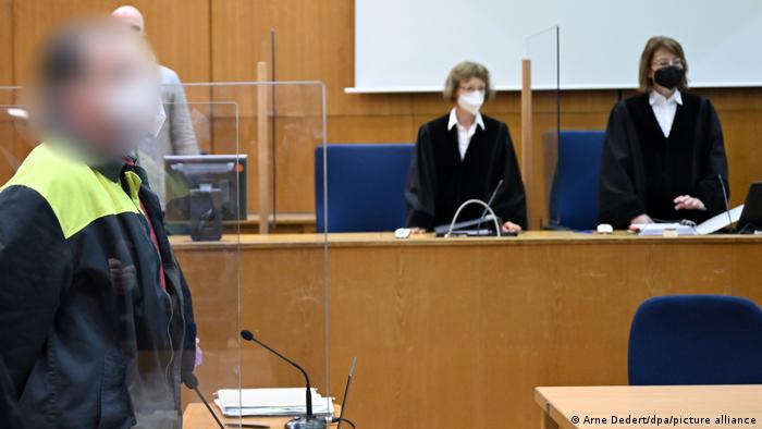 courtroom in Frankfurt with judges and defendant (pixelated)