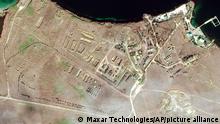 This Feb. 15, 2022 satellite image provided by Maxar Technologies shows military equipment positioned in convoy at Lake Donuzlav in Crimea. (Satellite image ©2022 Maxar Technologies via AP)