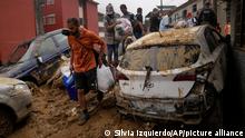 Residents recover belongs from thier homes destroyed by mudslides in Petropolis, Brazil, Wednesday, Feb. 16, 2022. Extremely heavy rains set off mudslides and floods in a mountainous region of Rio de Janeiro state, killing multiple people, authorities reported. (AP Photo/Silvia Izquierdo)