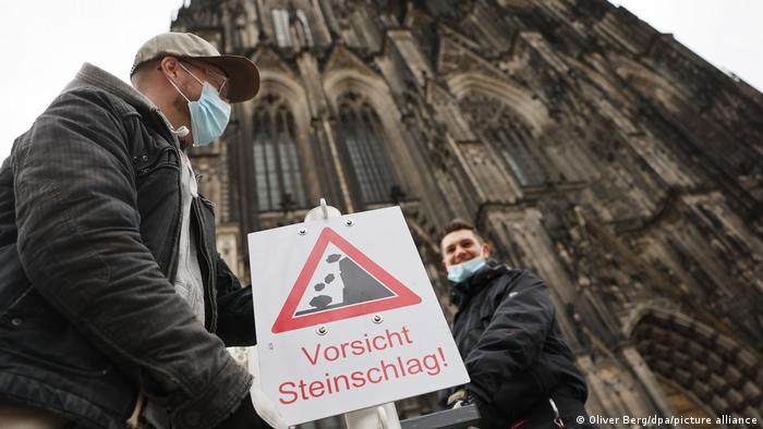 Cologne Cathedral warns people of falling stones