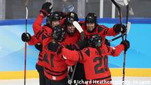 BEIJING, CHINA - FEBRUARY 17: Marie-Philip Poulin #29 of Team Canada reacts with teammates after scoring a goal in the second period during the Women's Ice Hockey Gold Medal match between Team Canada and Team United States on Day 13 of the Beijing 2022 Winter Olympic Games at Wukesong Sports Centre on February 17, 2022 in Beijing, China. (Photo by Richard Heathcote/Getty Images)
