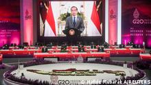 Indonesia President Joko Widodo is seen on a screen delivering his speech during G20 finance ministers and central bank governors meeting (FMCBG) at Jakarta Convention Center, Jakarta, Indonesia, February 17, 2022. Hafidz Mubarak A /Pool via REUTERS 