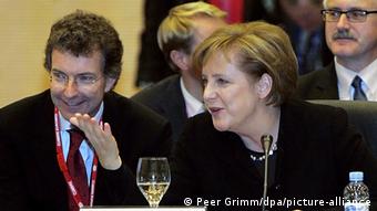 Κρίστοφ Χόισγκεν, Άνγκελα Μέρκελ