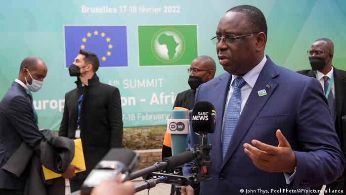 AU chair and Senegalese President Macky Sall speaks with reporters at the EU-Africa summit in Brussels