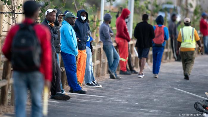 Men at a road junction in Cape Town