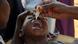 A child receives an oral polio vaccine in Uganda A child receives an oral polio vaccine in Uganda