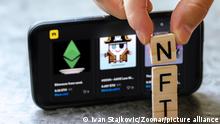 Vienna Austria June.5 2021: NFT or Non-Fungible token letters and dices, nft?s are a blockchain market for art and collections