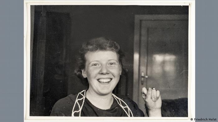 Erika Holst smiles while looking at the camera