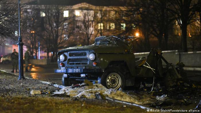 A car blown up on a parking lot outside a government building in central Donetsk