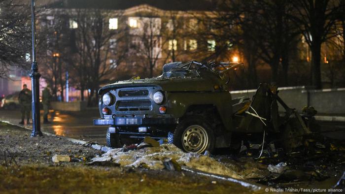 A car blown up on a parking lot outside a government building in central Donetsk