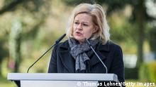 HANAU, GERMANY - FEBRUARY 19: Nancy Faeser, German Minister for Interior and Community, speaks during the commemoration for the victims of the 2020 mass shooting at the main cemetery on February 19, 2022 in Hanau, Germany. On February 19, 2020 Tobias Rathjen shot dead nine people with immigrant backgrounds in a shooting spree in the city center before killing himself and his mother. In days before the shootings he had posted an online manifesto laden with xenophobia and conspiracy claims. (Photo by Thomas Lohnes/Getty Images)