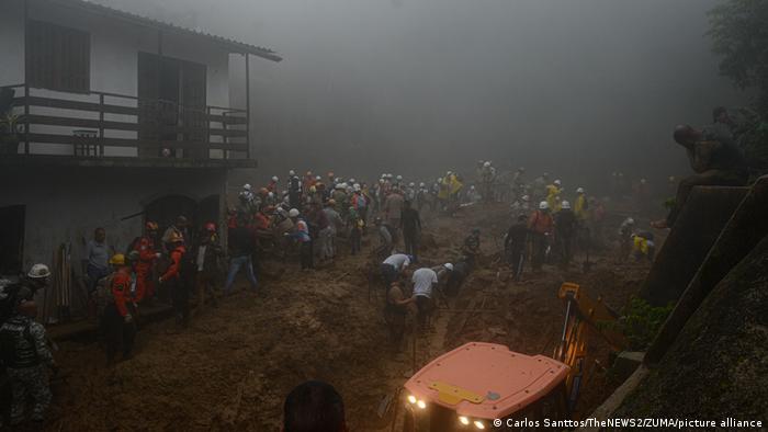 Searches for buried victims after flooding in Petropolis