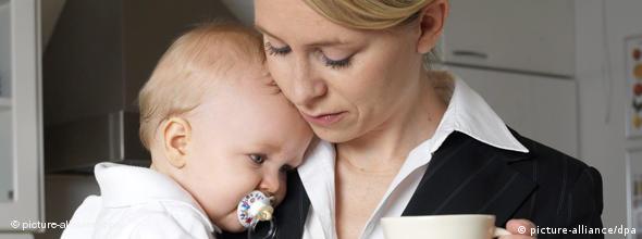 Woman in business suit with baby