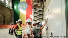 19.02.2022
Workers are seen at the site of the Grand Ethiopian Renaissance Dam (GERD) in Guba, Ethiopia, on February 19, 2022. - Ethiopia's massive hydro-electric dam project on a tributary of the Nile has raised regional tensions notably with Egypt, which depends on the huge river for 97 percent of its water supply.
Government officials said the dam would begin producing electricity on Sunday, more than a decade since work first started. (Photo by Amanuel SILESHI / AFP) (Photo by AMANUEL SILESHI/AFP via Getty Images)
