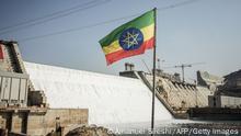 19.02.2022
This general view shows an Ethiopian national flag flying infront of the Grand Ethiopian Renaissance Dam (GERD) in Guba, Ethiopia, on February 19, 2022. - Ethiopia's massive hydro-electric dam project on a tributary of the Nile has raised regional tensions notably with Egypt, which depends on the huge river for 97 percent of its water supply.
Government officials said the dam would begin producing electricity on Sunday, more than a decade since work first started. (Photo by Amanuel SILESHI / AFP) (Photo by AMANUEL SILESHI/AFP via Getty Images)