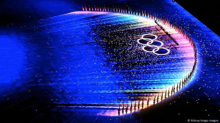 The flag bearers of each nation form a huge semi-circle around the Olympic rings at the Bird's Nest Stadium in Beijing as the closing ceremony brings to an end the 2022 Winter Olympics.