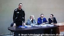 VLADIMIR REGION, RUSSIA - FEBRUARY 21, 2022: Pictured in this image is a monitor showing opposition activist Alexei Navalny and his lawyer Olga Mikhailova (L-R) during an on-site Lefortovo District Court hearing against Navalny at Penal Colony No 2 in Pokrov, Vladimir Region. Navalny is facing charges of contempt of court (in connection with his trial for defaming a WWII veteran) and large scale fraud. Sergei Fadeichev/TASS