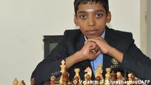 This handout photograph released by the Velammal School on June 25, 2018 and taken on February 12 shows Indian chess prodigy Rameshbabu Praggnanandhaa posing for a photograph with a chess board at the school in the southern Indian city of Chennai. - A 12-year-old Indian boy described as unstoppable by his proud father has become the world's second youngest chess grandmaster ever. Rameshbabu Praggnanandhaa, the son of a bank employee from the southern city of Chennai, achieved the feat with some aggressive play at an event in northern Italy that ended June 24. (Photo by Handout / VELAMMAL SCHOOL / AFP) / -----EDITORS NOTE --- RESTRICTED TO EDITORIAL USE - MANDATORY CREDIT AFP PHOTO / VELAMMAL SCHOOL - NO MARKETING - NO ADVERTISING CAMPAIGNS - DISTRIBUTED AS A SERVICE TO CLIENTS -