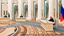 Russian President Vladimir Putin attends a ceremony to sign documents, including a decree recognising two Russian-backed breakaway regions in eastern Ukraine as independent entities, with leaders of the self-proclaimed republics Leonid Pasechnik and Denis Pushilin seen in the background, in Moscow, Russia, in this picture released February 21, 2022. Sputnik/Alexey Nikolsky/Kremlin via REUTERS ATTENTION EDITORS - THIS IMAGE WAS PROVIDED BY A THIRD PARTY.