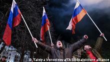 DONETSK, DONETSK PEOPLE'S REPUBLIC - FEBRUARY 22, 2022: Donetsk residents celebrate recognition of independence of the Donetsk and Lugansk People's Republics by Russia. Russian President Putin signed decrees recognizing independence of the Donetsk and Lugansk People's Republics on February 21, 2022. Taisiya Vorontsova/TASS