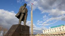 DONETSK, UKRAINE - FEBRUARY 21, 2022: A Russian flag waves by a monument to Russian revolutionary Vladimir Lenin. Denis Pushilin, head of the Donetsk People's Republic, asks Russian President Vladimir Putin to recognize independence of the Donetsk People's Republic. As tension escalated in east Ukraine on 18 February, 2022, the Donetsk People's Republic announced a mass evacuation of civilians to Russia. On 19 February 2022, it announced general mobilisation. Alexander Ryumin/TASS