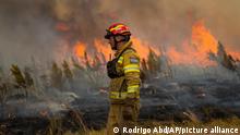 A firefighter works to extinguish a brush fire in Santa Tecla, Corrientes province, Argentina, Sunday, Feb. 20, 2022. Fires continue to ravage the Corrientes province that has burnt over half-a-million hectares. (AP Photo/Rodrigo Abd)
