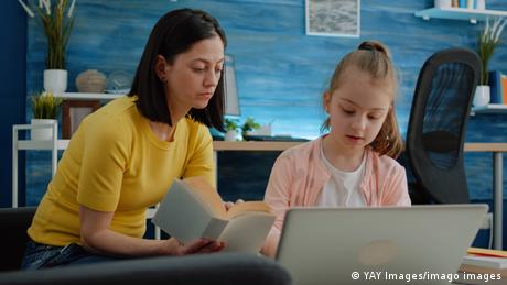 Mother and child in front of a laptop