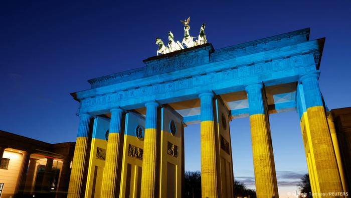 The Brandenburg Gate in the German capital Berlin is illuminated in Ukrainian national colors