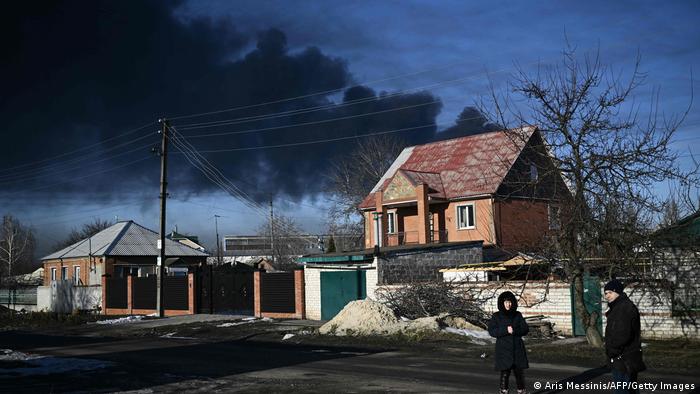 Black smoke rises over the military airport in Chuguev near Kharkov.