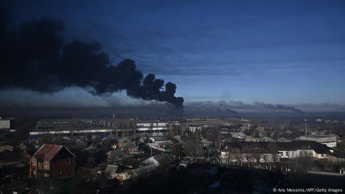 Black smoke rises from a military airport in Chuguyev near Kharkiv on February 24, 2022