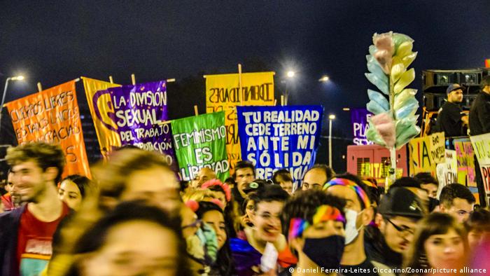 A large crowd with placards is seen celebrating Montevideo pride parade