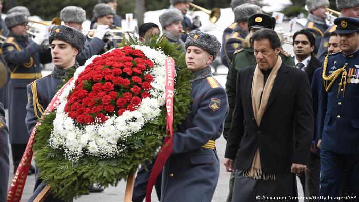 Pakistan's Prime Minister Imran Khan takes part in a wreath-laying ceremony at the Tomb of the Unknown Soldier by the Kremlin Wall in Moscow on February 24, 2022