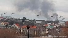 In this handout photo taken from video released by Ukrainian Police Department Press Service, Military helicopters apparently Russian, fly over the outskirts of Kyiv, Ukraine, Thursday, Feb. 24, 2022. Russian troops have launched their anticipated attack on Ukraine. Big explosions were heard before dawn in Kyiv, Kharkiv and Odesa as world leaders decried the start of an Russian invasion that could cause massive casualties and topple Ukraine's democratically elected government. (Ukrainian Police Department Press Service via AP)