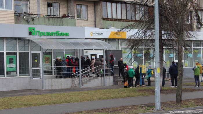 A queu in front of an ATM machine in Kyiv. 