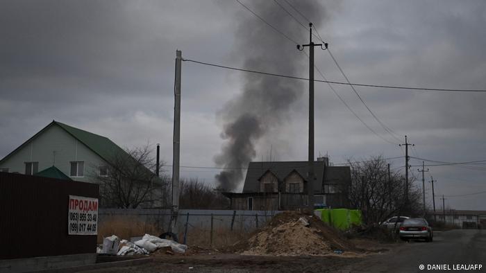 A plume of smokes is seen rising from Antonov Airport, in northwest Kyiv